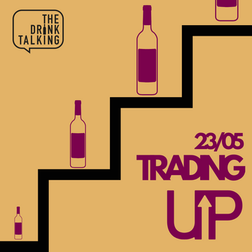 steps with wine bottles on with words @trading Up'